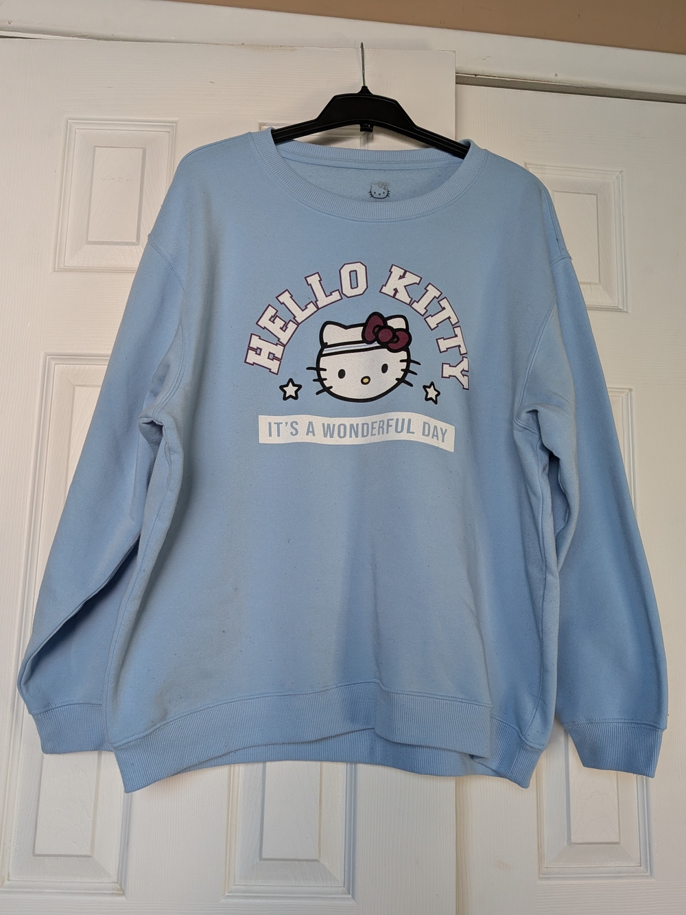 Hello Kitty Pastel Blue Crewneck Sweatshirt with Graphic Bow